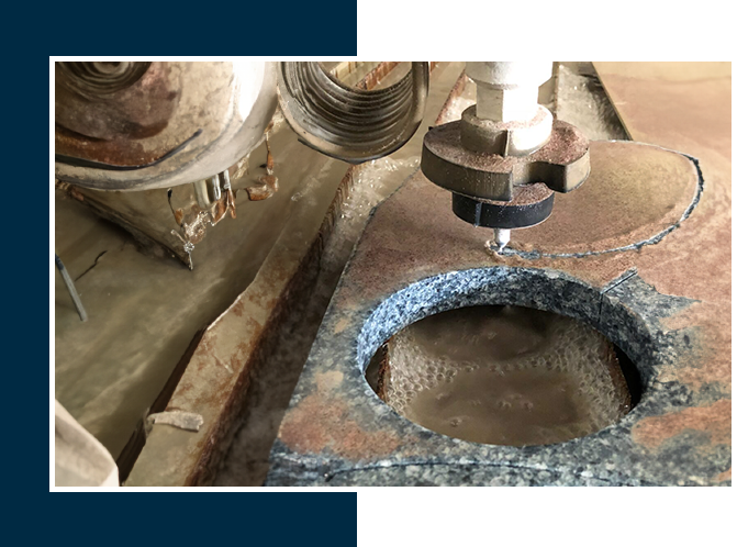 A machine cutting metal with a hole in the center.